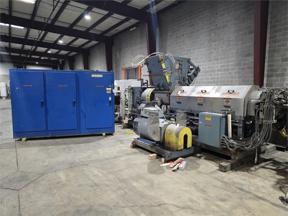 Used pneumatic ram stuffer force feeder on plastic extruder for feeding low bulk density film scrap and regrind