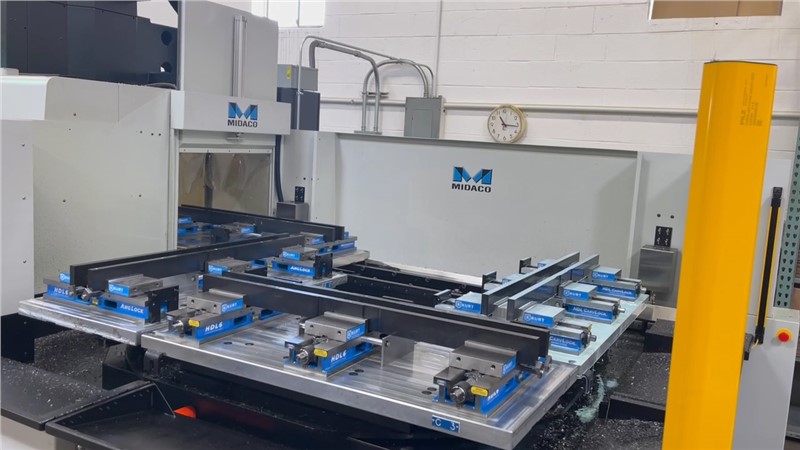 Midaco Automatic Rotary 4-Pallet Changer with pallet moving into VMC in Machine shop 