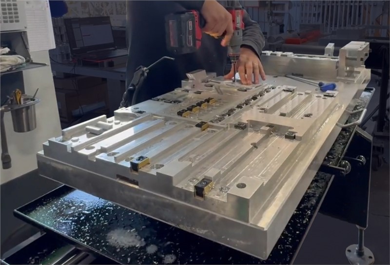 Machinist setting up parts on a Midaco Manual Pallet Changer