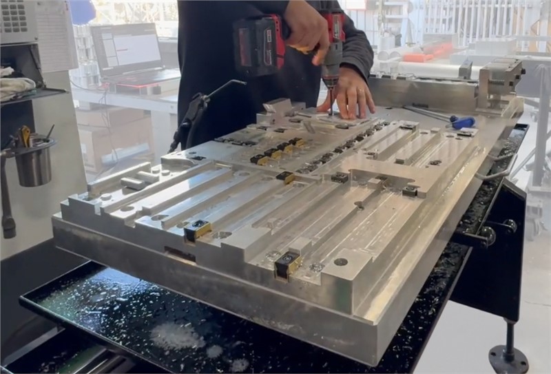 Machinist setting up parts on a Midaco Manual Pallet Changer